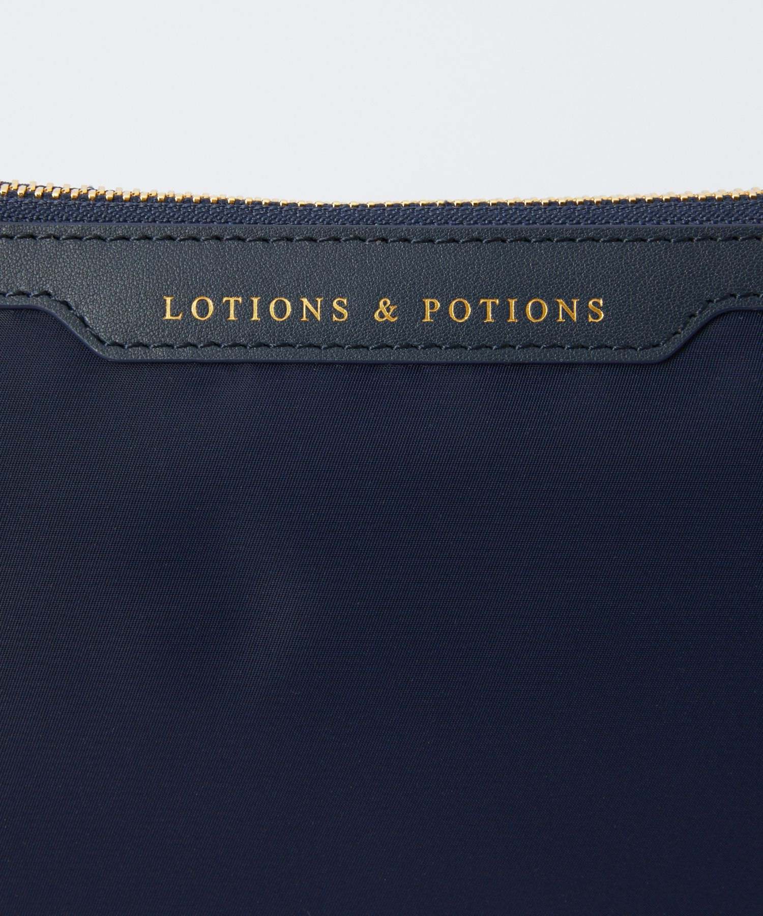 LOTIONS AND POTIONS Clutch Bag 