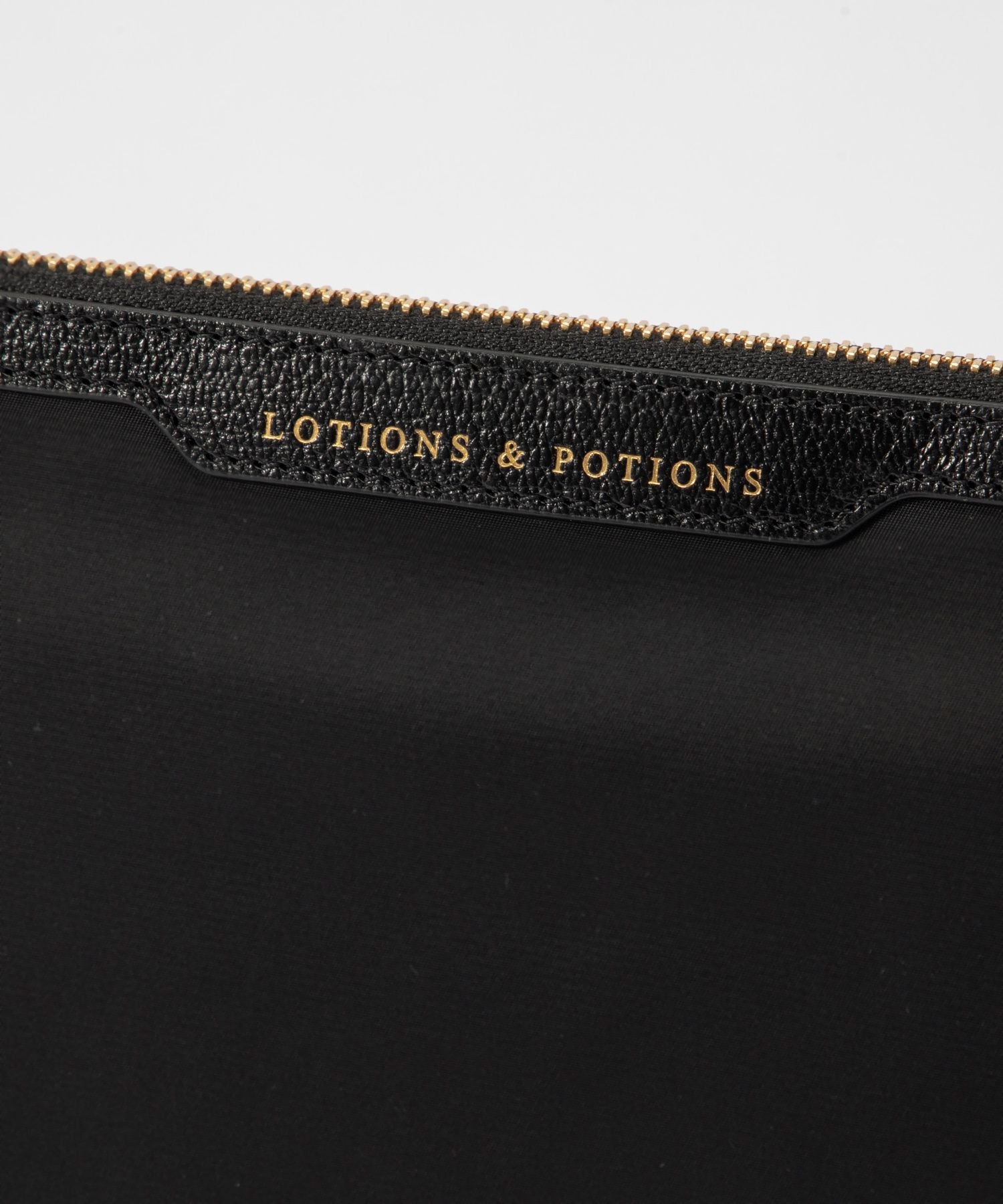 LOTIONS AND POTIONS Clutch Bag 